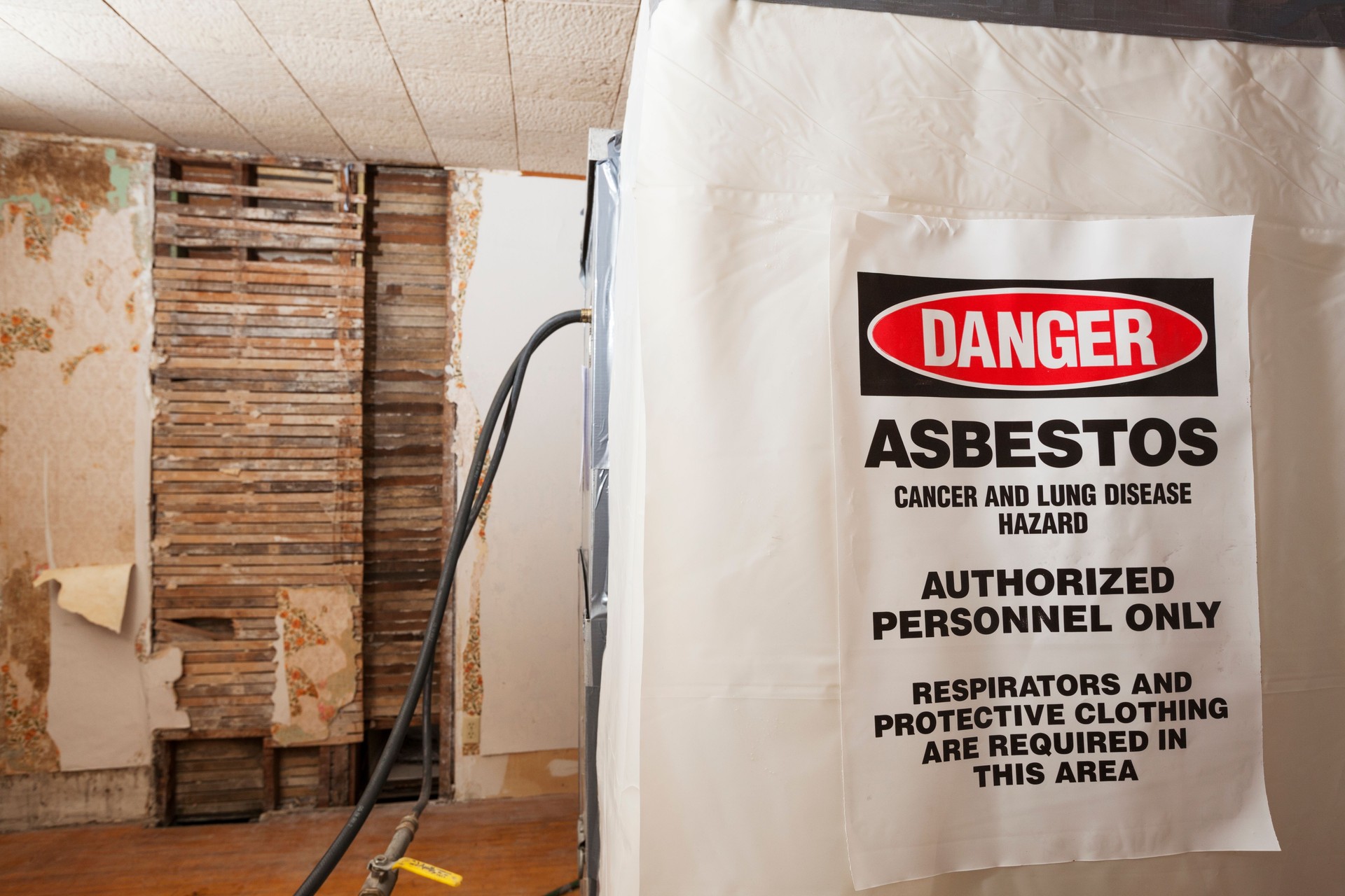 Asbestos Warning Danger Sign on a Decontamination Chamber